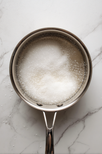 mixing-lemon-juice-and-water-into-sugar-syrup