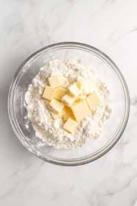 mixing-the-sugar-butter-and-flour-mixture-in-a-bowl