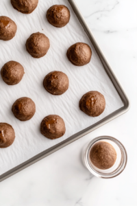 nutella-cookie-dough-balls-on-baking-sheet-and-in-glass-bowl