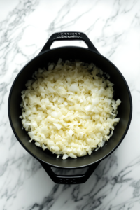 onions-garlic-sizzling-in-black-dutch-oven
