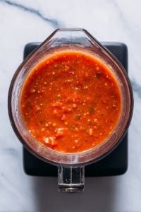 partially-blended-gazpacho-in-glass-blender