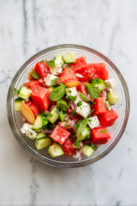 peach-watermelon-salad-gently-tossed-in-glass-bowl