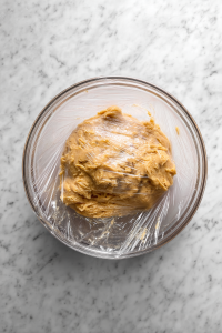 plastic-wrapped-glass-bowl-pumpkin-cookie-dough-chilling