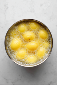 potatoes-boiling-in-large-silver-pot-white-marble-top
