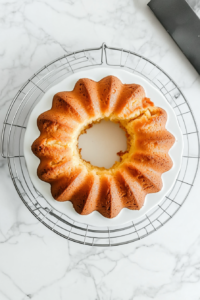 pound-cake-cooling-on-wire-rack-on-white-marble