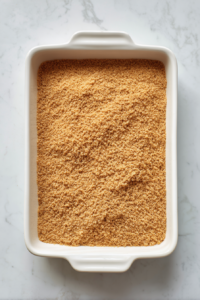 pressed-peanut-butter-crumb-mixture-in-white-ceramic-baking-dish-2