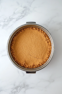 pressing-biscuit-mixture-into-pan