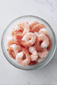 raw-shrimp-in-glass-bowl-on-white-marble