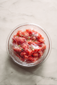 salad-covered-and-chilling-in-glass-bowl