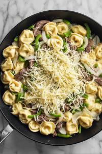 shredded-provolone-sprinkled-on-skillet-mixture-2