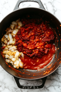 tomato-paste-and-sun-dried-tomatoes-in-black-dutch-oven