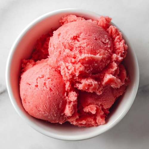 vibrant-homemade-watermelon-sorbet-in-white-bowl-on-marble