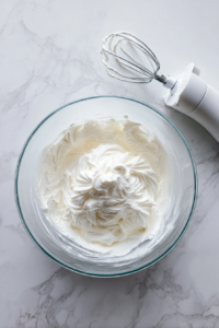 whipping-cold-cream-in-clear-glass-bowl