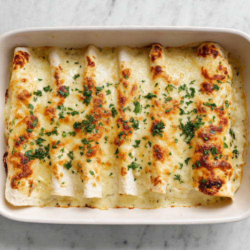 white-chicken-enchiladas-featured-top-down-baked-cheesy