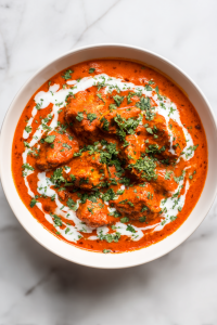 yogurt-stirred-into-chicken-masala-and-garnished-with-coriander