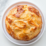 no-knead-dutch-oven-bread-on-a-round-white-plate-9301494