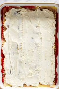 Add a layer of noodles, then spread ricotta