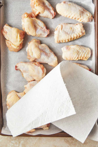 Pat the chicken wings dry with a clean kitchen towel