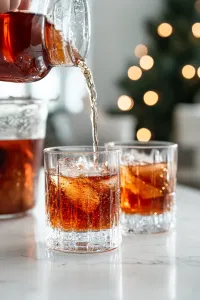 Pour the warm punch into glasses